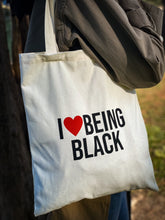 Load image into Gallery viewer, Use this I love Being Black tote bag for a visit to the library, day at the beach or a day of grocery shopping. Super cute and aesthetic tote bag for men and women.